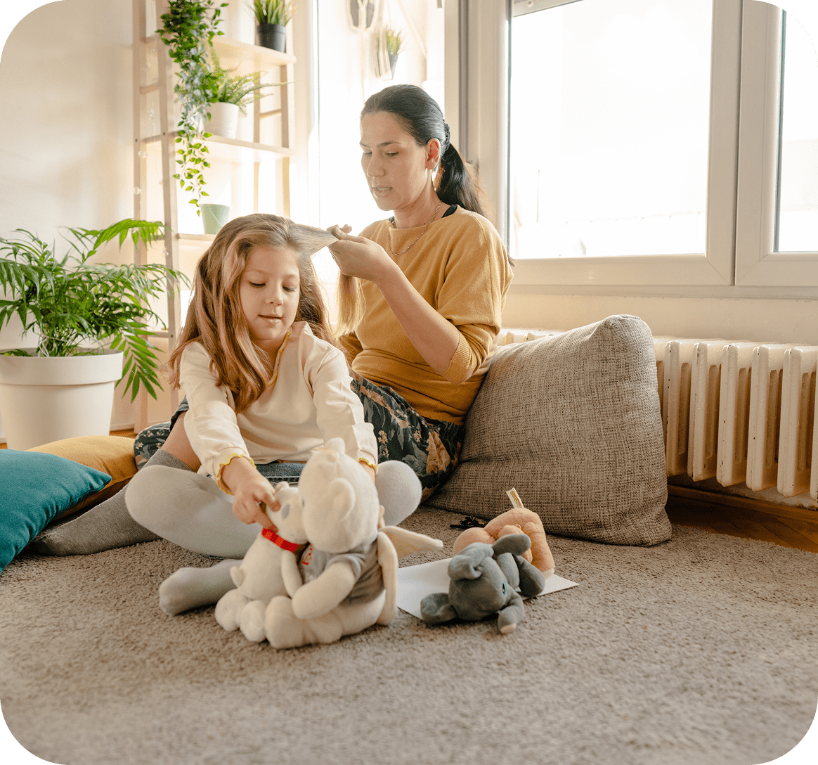 Woman and girl enjoying quality time indoors
