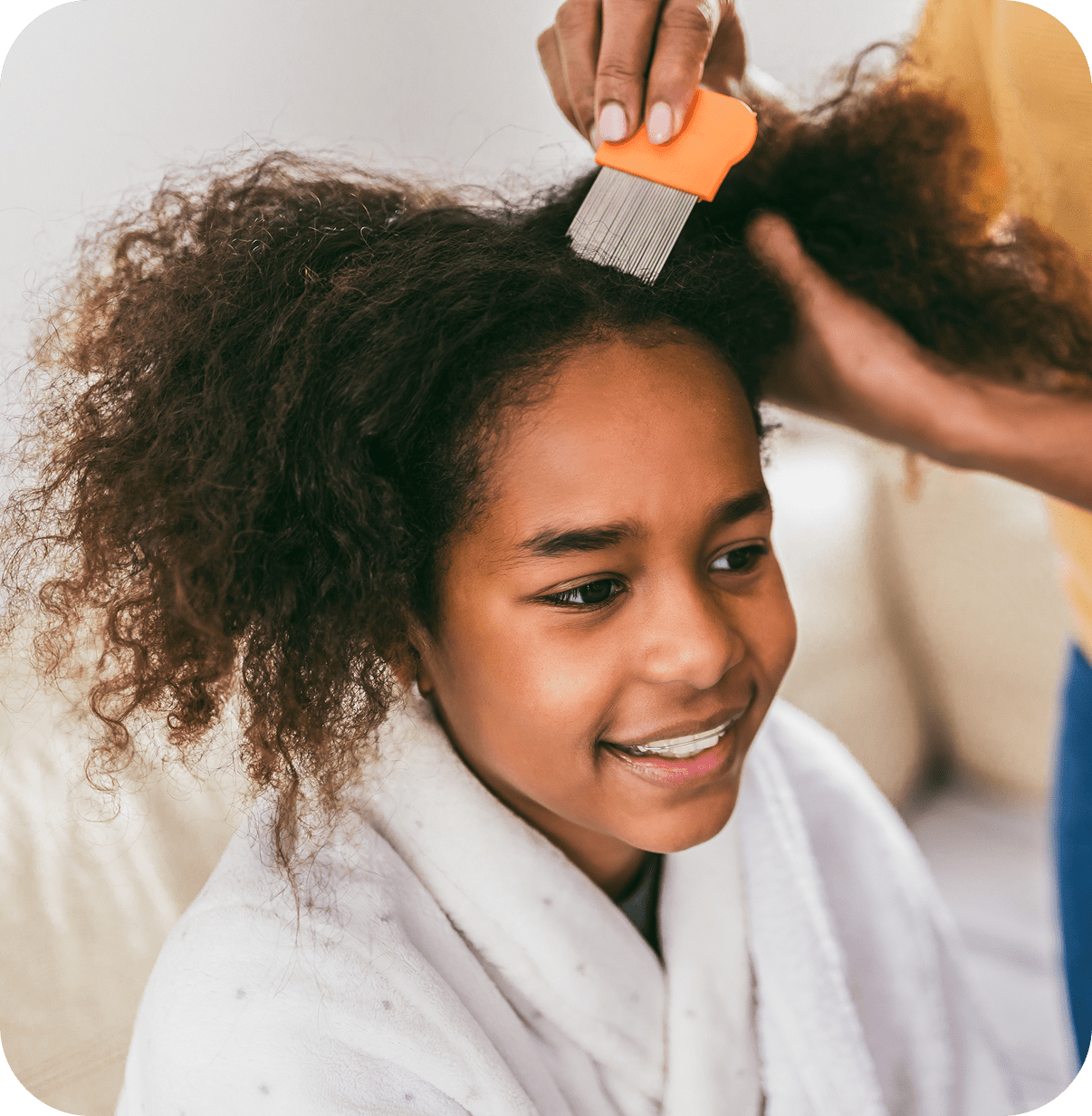 Smiling girl during hair care routine